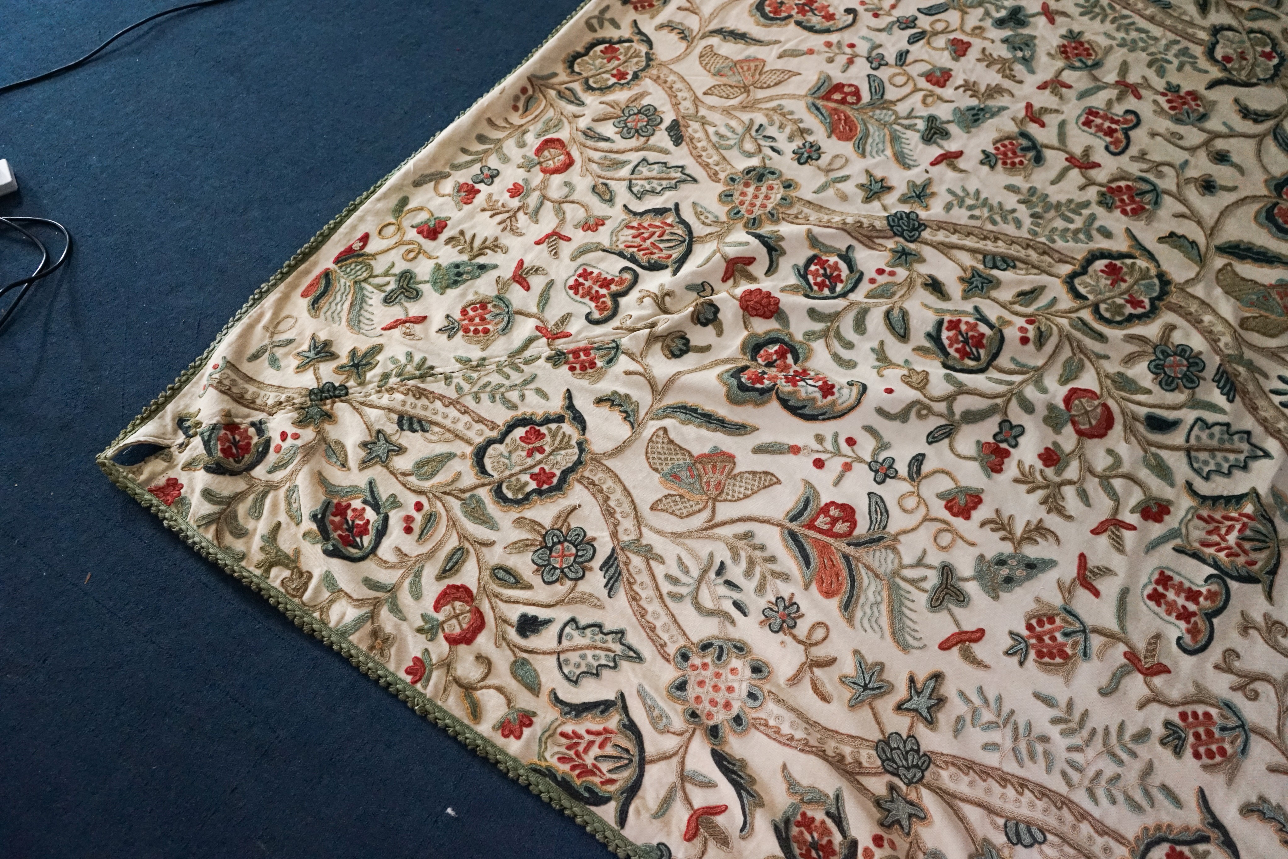 A Chelsea Textiles crewel work double bed spread, 550 x 260cm